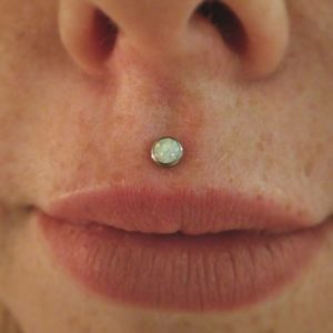 centered medusa lip piercing