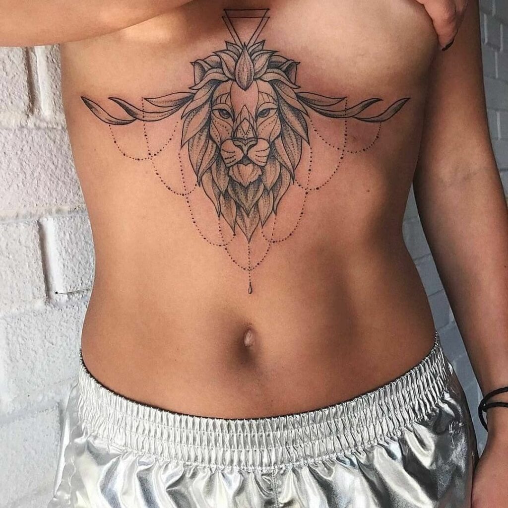 Lion under breast tattoo 