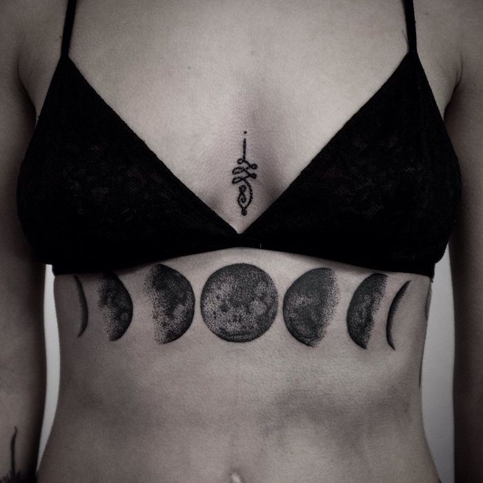 Moon tattoo underneath breast