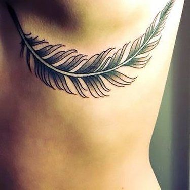 Feather inked under breast tattoo