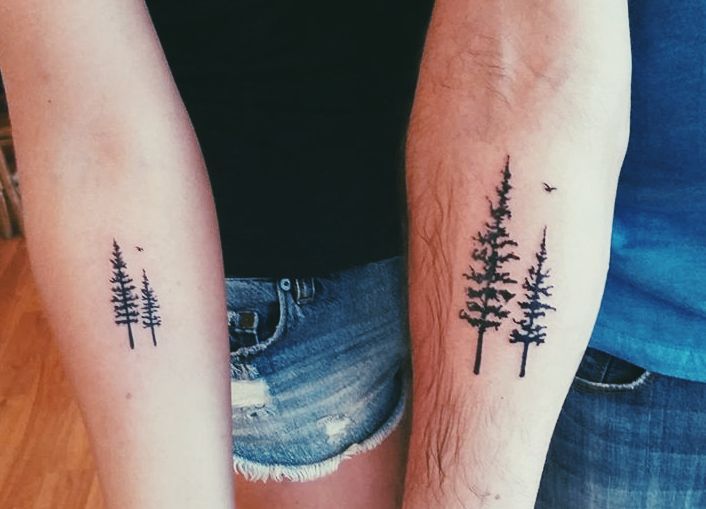 Matching tattoo of a pine tree