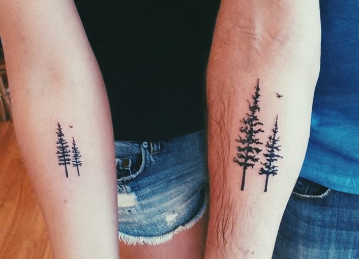 Matching tattoo of a pine tree