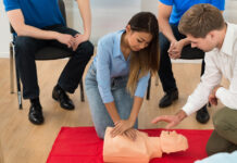 What does a chest compression feedback device monitor