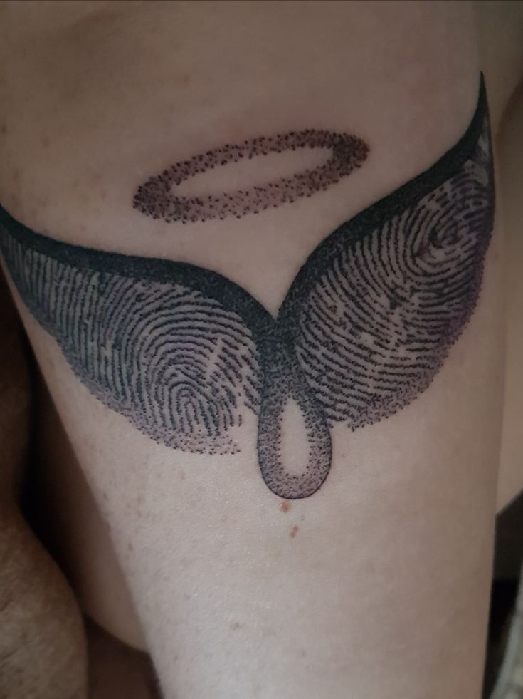 Winged Fingerprint Tattoo